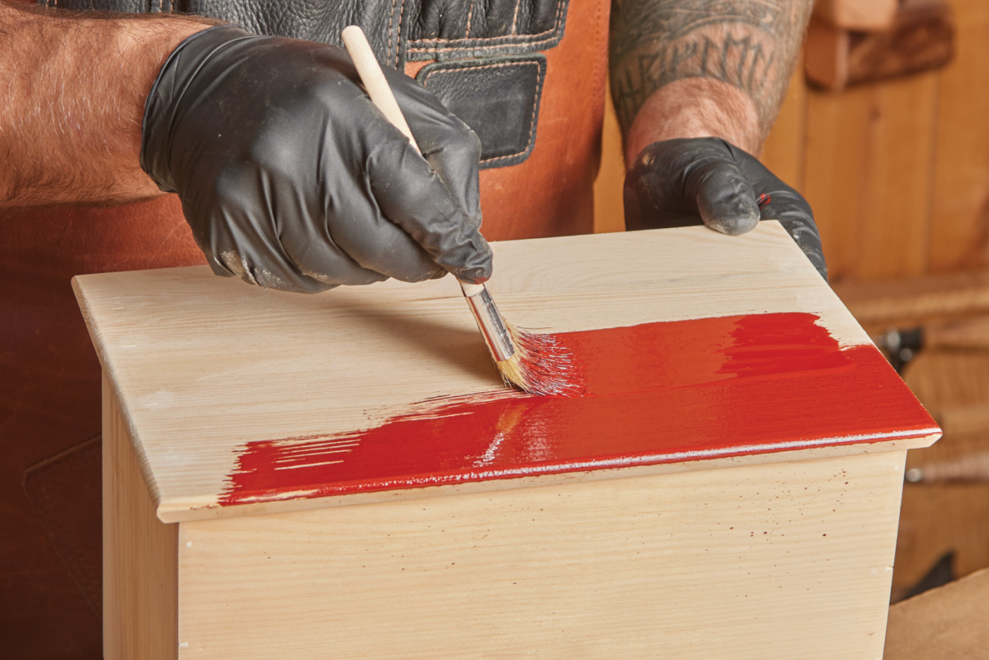 Linseed oil paint being applied to a woodworking piece